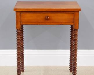 A late 19th century Victorian Period lamp table. Cherry construction with a single dovetailed drawer and bobbin turned legs. Refinished with minor wear. 23 x 16 1/2 x 29" high overall. ESTIMATE $100-200