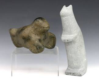 Two 20th century Inuit carved stone figures of animals. Includes a figure of a dog (or bear) from Whale Cove hamlet, Kivalliq Region, and a figure of a seal. Dog signed in syllabics at side (n.d), retains paper label and original 1970's purchase receipt from "Eskimo Art Inc" in Ann Arbor, MI that cite artist as "Nikki" (n.d.), seal is unsigned. Minor surface wear. Up to 8" long and 4" high. ESTIMATE $200-300