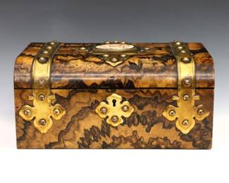 A late 19th century English Victorian Period box by T.W. Hopkins, London. Walnut construction with original grain painted "Burl" finish and Bronze mounts, hinged top features a porcelain insert with Cherub decoration that opens to reveal an open interior with fitted lid. Engraved "Feb.Y 12th 1867" at top and applied Brass label with "Hopkins, Maker / 22 New Bond St." at interior. Minor shrinkage and losses to veneer, porcelain insert cracked, monogrammed "LP" at lid. 9 3/4 x 6 3/4 x 4 1/2" high overall. ESTIMATE $400-600