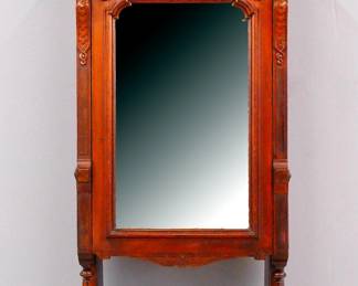 A 19th century Victorian Eastlake Period boudoir desk. Walnut construction with Burl panels and carved decoration features a shaped crest over a fold-down writing desk with mirrored front panel and inset felt writing surface which opens to reveal a fitted interior with compartments and drawers, above an open shelf and scrolled base. Older finish with wear and minor damage, replaced leather. 27 1/2 x 11 1/2 x 68 1/2" high overall. ESTIMATE $300-500