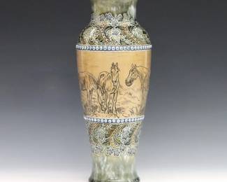 An early 20th century Royal Doulton porcelain vase designed by Hannah Barlow and Florence C. Roberts. Baluster form with incised horse design between floral borders with multicolor glaze. Hannah Bolton Barlow was the first female artist to work for Royal Doulton. Impressed "Royal Doulton / England" mark with interlocking D's, Crown and Lion used from 1901-1922, with "HBB" monogram, "FCR" and "MB" (assistant decorator Maud Bowden) initials with an "F" in cartouche, "930" and "336". Minor wear. 10 3/4" high. ESTIMATE $600-800