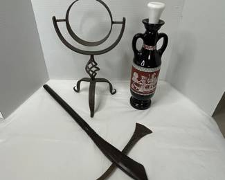 Vintage Iron Stand, Black Beam Bottle with Historical Design, Decorative Bladed Tool