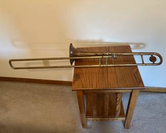 old trombone, one of pair of oak end tables
