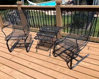 Pair of wrought iron rocker chairs, wrought iron nesting tables