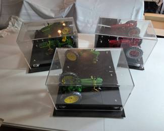 Three John Deere and McCormick Model Tractors