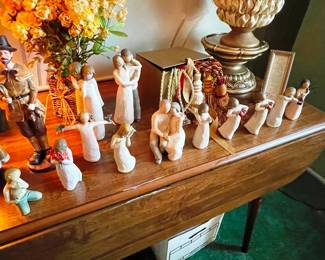 Willow Tree collectibles on a drop leaf dining table