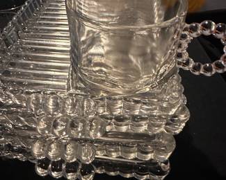 Set of 4 very detailed glass serving trays with cups.