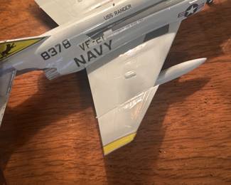 diecast model of a McDonnell Douglas F-4 Phantom II, specifically a US Navy version
