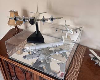 Collection of model aircraft, including a prominent model of a B-29 Superfortress bomber. 
