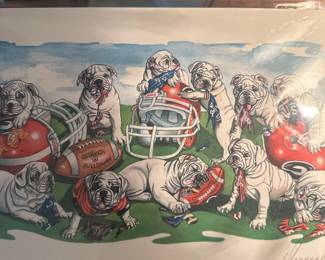 Framed art print titled "Bulldawgs in Training" featuring Georgia Bulldogs puppies with football helmets and equipment