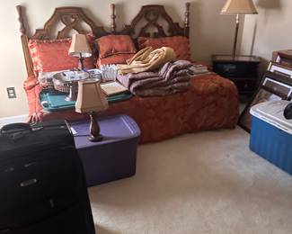 Bedframe, bedding, lamps, suitcases, and more.