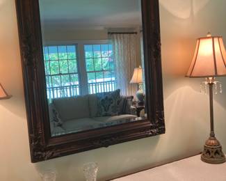 Vintage wall mirror with carved wooden frame