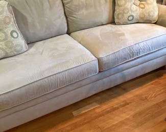 Three seat, upholstered couch, sleeper bed, and light neutral fabric