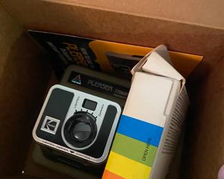 Cameras, Polaroids in the box…