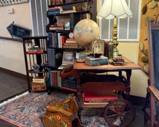 Vintage lamp, globe, antique rolling cart, bookshelf, deco items, books, brass candlesticks