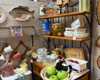 mugs, apples, pottery, baker's rack, vintage casserole dishes and Corning Ware.