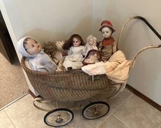 Antique wicker stroller with dolls
