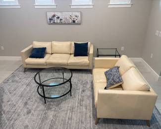 Grey area rug 11 ft 10 in x 9 ft-$200 cream colored leather loveseat 16” x 55” x 33”-$375 cream colored leather sofa 16” x 80” x 34” -$475