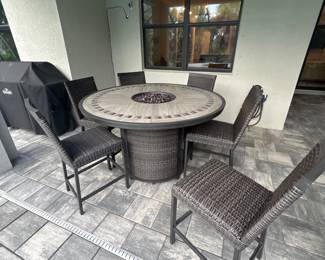 Agio high top fire table with 6 matching chairs 37” x 60” chairs 25” x 19” x 20”-$750