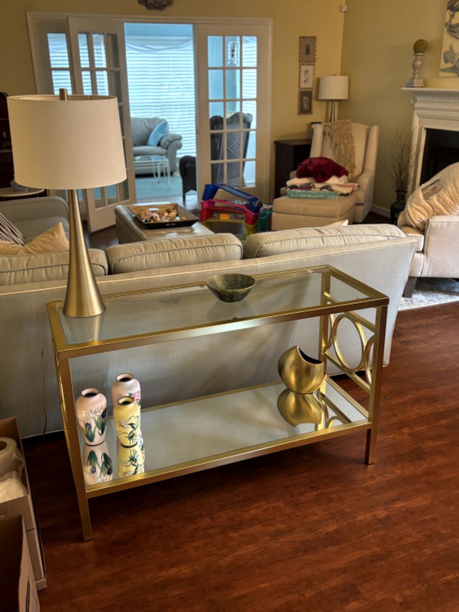 Gold console table and decor.