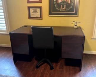 Large desk and leather chair.