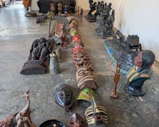 Variety of masks and carved furniture available.