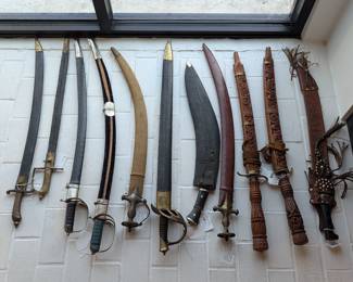 Large collection of swords, knives, and spears available