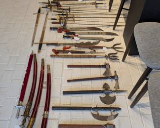 Large collection of swords, knives, and spears available