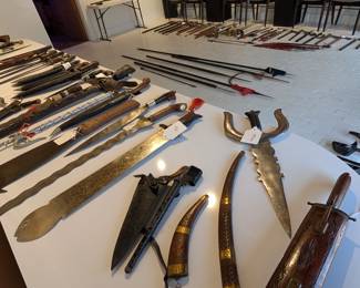 Large collection of swords, knives, and spears available