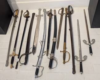 Large collection of swords, knives, and spears available
