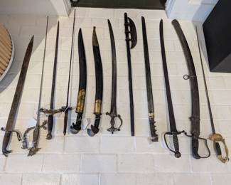 Large collection of swords, knives, and spears available