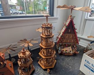 Collectible Christmas decor including a variety of sizes of wooden Christmas candle pyramids.  