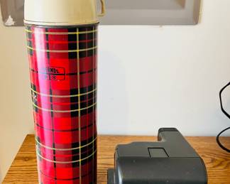Vintage thermos and Polaroid camera 