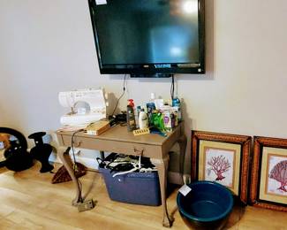 TV, vintage wood vanity table, sewing machine, green round pedicure bowl and more