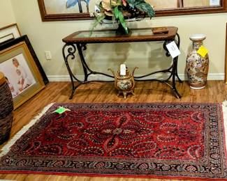 Round accent table, foyer table, nice rug, art