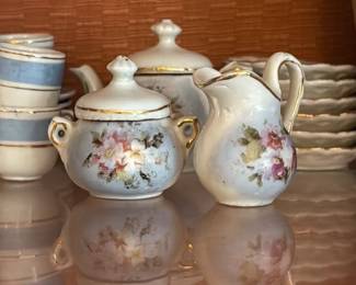 Victorian Porcelain Tea Set with Floral Motifs 