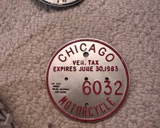 Multiple vintage motorcycle plates