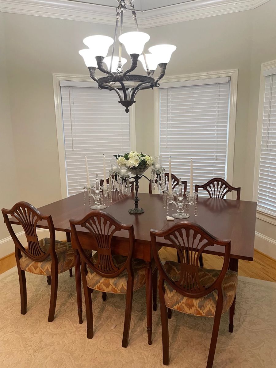 large drop leaf dining table, six chairs, small area rug, metal and crystal candelabra 