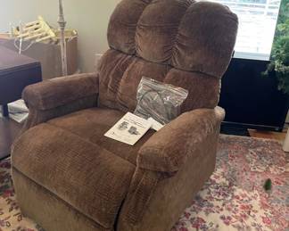 Recliner with remote and paperwork included, area rug, several TV's