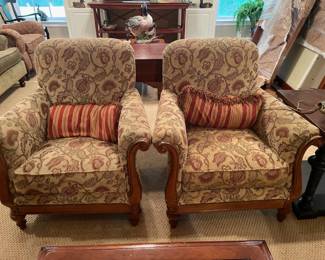 pair of upholstered with wood club chairs