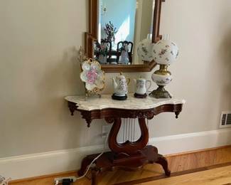 detailed harp base with marble top side table, hand painted china for coffee and tea, lamp and beveled mirror