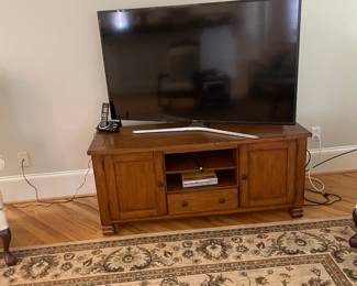 One of two cabinets for TV or coffee table, one of six TV's , area rug