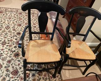 2 black and rattan arm chairs- also we have 1 without arms 