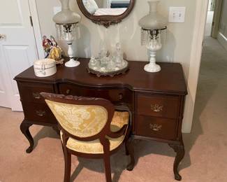 gold framed mirror, table mirror, china figurines, claw foot vanity/desk with chair and two hobnail milk glass with crystal lamps