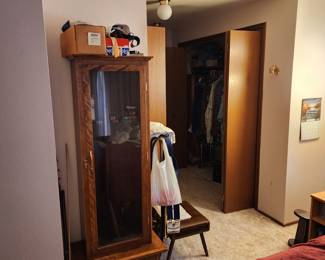 Oak gun cabinet, beebee gun and supplies