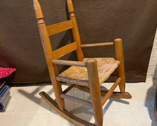 A22 - $40. Antique Childs Rocking Chair.