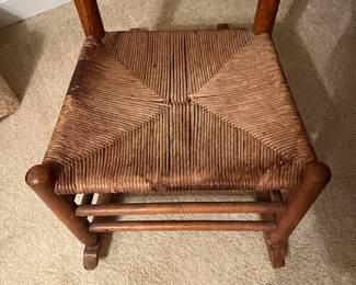 B47 - $50. Ladder Back Rocking Chair. Measures 18" wide x 15" deep x 34.5" tall.