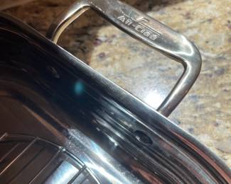 K13 - $40. All-Clad Stainless Roasting Pan (rack not included). 18" long with handles x 12" wide x 2.25" tall.