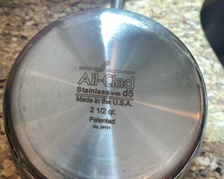 K6 - $55. All-Clad Stainless D5 pot with lid. 2.5 quart. Measures 4" tall.