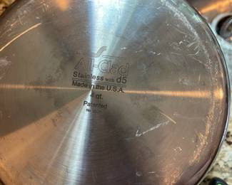 K8 - $85. All-Clad D5 Stainless Pot with Lid. 4 qt. Pot is 5" tall.